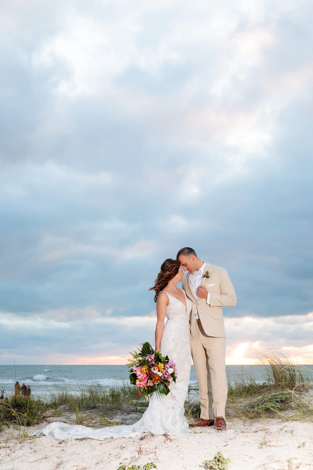 Tropical Clearwater Beach Intimate Bride with Braided Crown Half Up Hairdo and Groom Wedding Portrait on Beach | Tampa Bay Wedding Photographer Limelight Photography