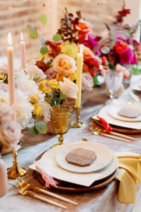 Whimsical and Colorful Wedding Reception Decor, Yellow Tall Candlesticks, Pink, Yellow and Orange Low Floral Centerpiece, Gold Flatware, Yellow Napkin Linen, Wooden Place Card, Vintage Glassware | Tampa Bay Wedding Photographer Dewitt for Love | Linen Rentals Kate Ryan Event Rentals