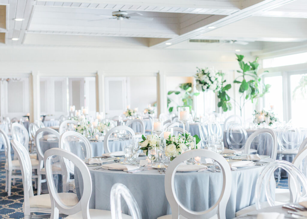 Elegant Light Blue and White Clearwater Wedding with White and Clear Ghost Chairs | Clearwater Beach Wedding Planner Parties A'La Carte | Clearwater Wedding Florist Bruce Wayne Florals
