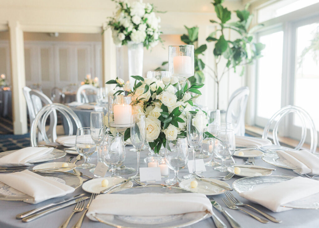 Elegant Light Blue and White Clearwater Wedding with White and Clear Ghost Chairs | Clearwater Beach Wedding Planner Parties A'La Carte | Clearwater Wedding Florist Bruce Wayne Florals | Carlouel Yacht Club | Wedding Rentals Gabro Event Services