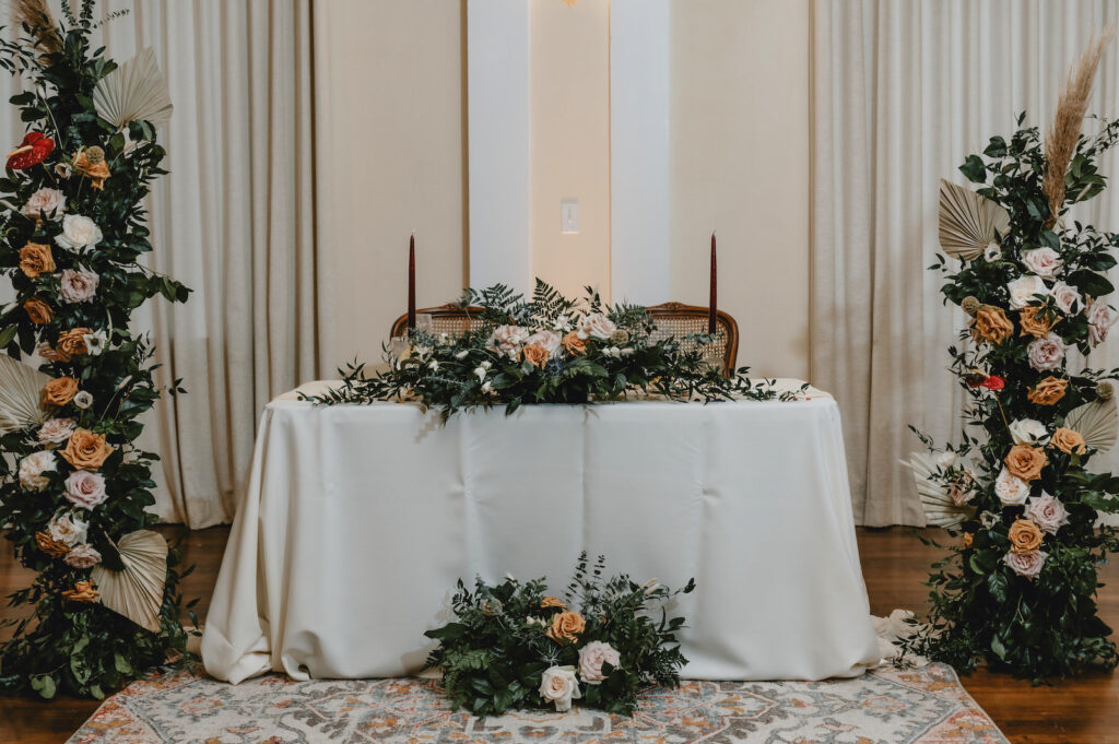 Fall Boho Wedding Sweetheart Table with Greenery and Florals | South Tampa Decor Kate Ryan Event Rentals
