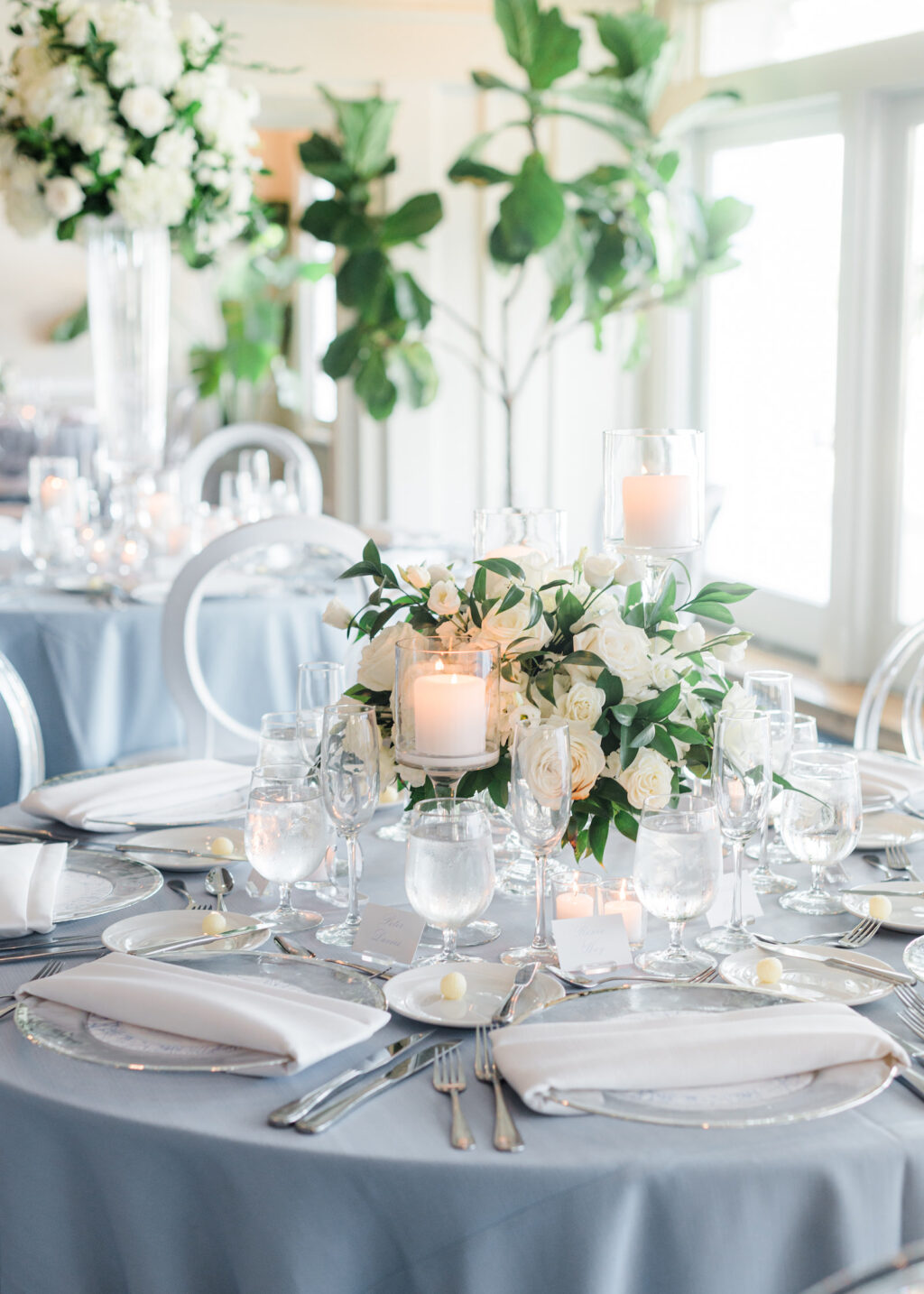 Elegant Light Blue and White Clearwater Wedding with White and Clear Ghost Chairs | Clearwater Beach Wedding Planner Parties A'La Carte | Clearwater Wedding Florist Bruce Wayne Florals | Carlouel Yacht Club | Wedding Rentals Gabro Event Services
