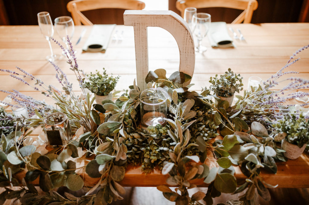 White Lettering Décor with Greenery and Candle | Rustic Wedding Décor and Tablescapes