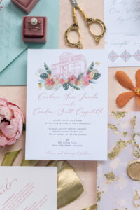 Colorful and Floral Wedding Invitation Suite with Watercolor Wedding Venue Historic Tampa The Cuban Club Design, Gold Painted Monstera Leaf, Pink Pin Cushion Protea, Pink Garden Rose, Engagement Ring in Mauve Ring Box | Tampa Bay Wedding Planner Eventfull Weddings