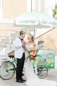 Vintage Bride and Groom Eating Popsicles from Gourmet Popsicle Bike Stand | Tampa Bay Wedding Planner Eventfull Weddings