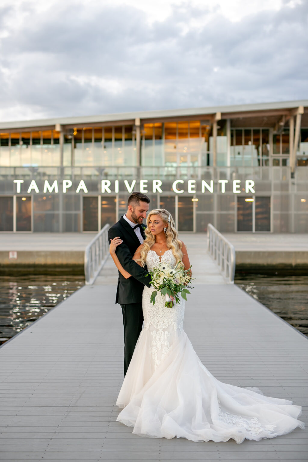 Florida Modern Elegant Bride and Groom on Dock | Wedding Venue Tampa River Center | Wedding Hair and Makeup Femme Akoi Beauty Studio