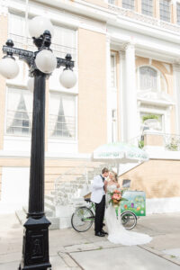 Vintage Bride and Groom Eating Popsicles from Gourmet Popsicle Bike Stand | Tampa Bay Wedding Planner Eventfull Weddings | Historic Tampa Wedding Venue The Cuban Club