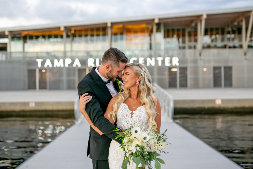 Florida Modern Elegant Bride and Groom on Dock | Wedding Venue Tampa River Center | Wedding Hair and Makeup Femme Akoi Beauty Studio
