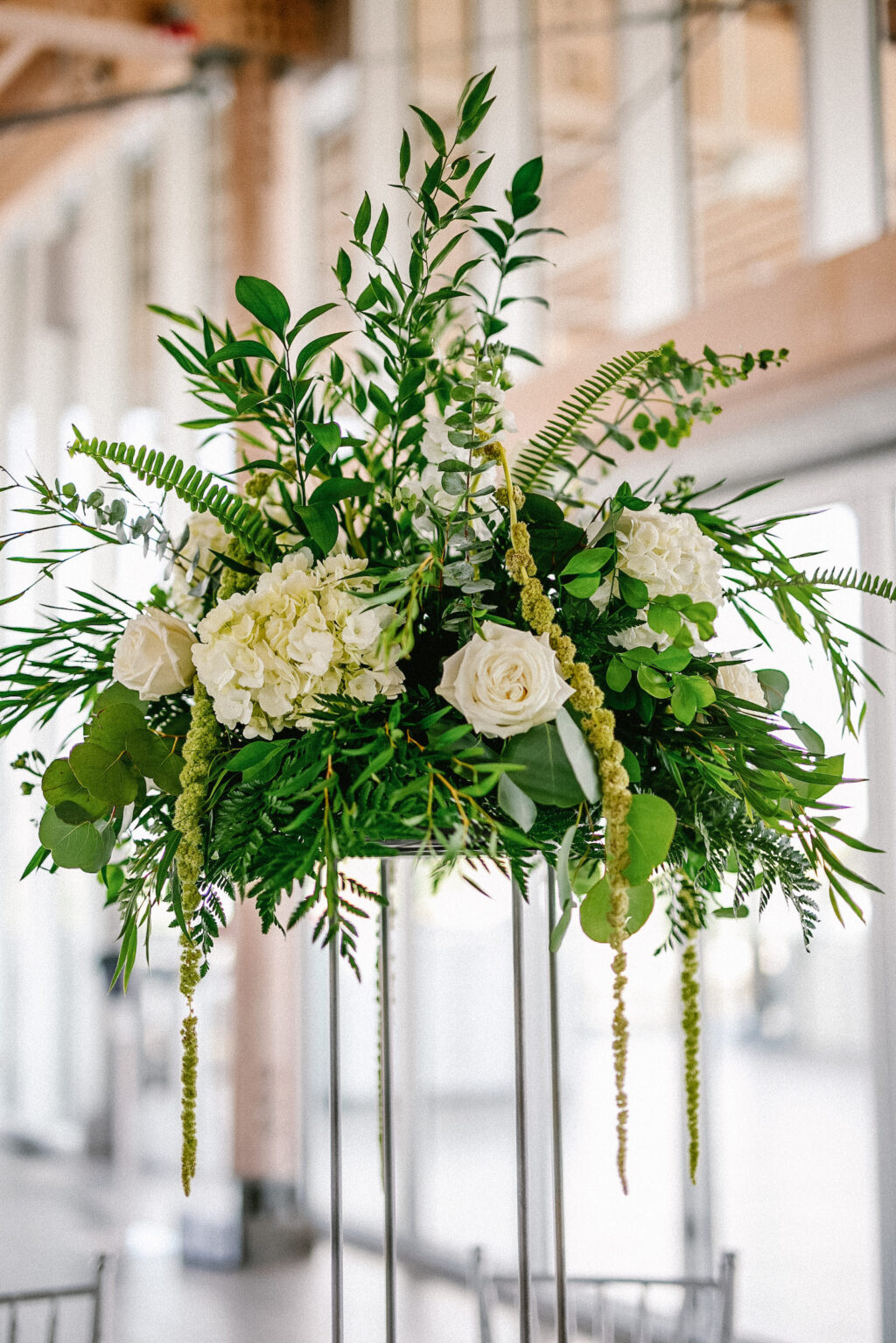 Modern Elegant Wedding Reception Decor, Tall Silver Stand with Greenery, White Roses and Hydragneas, Hanging Amaranthus Floral Centerpiece