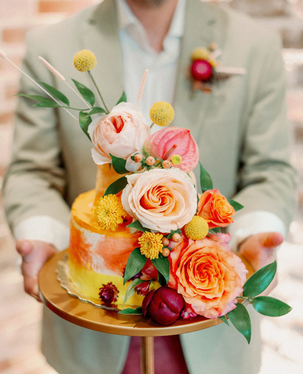 Whimsical and Colorful Yellow and Orange Small Two Tier Wedding Cake with Real Blush Pink and Orange Roses, Yellow Billy Ball Flowers | Tampa Bay Wedding Photographer Dewitt for Love