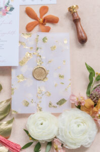 Translucent Vellum Jacket with Gold Foil Flakes and Gold Wax Seal Wedding Invitation