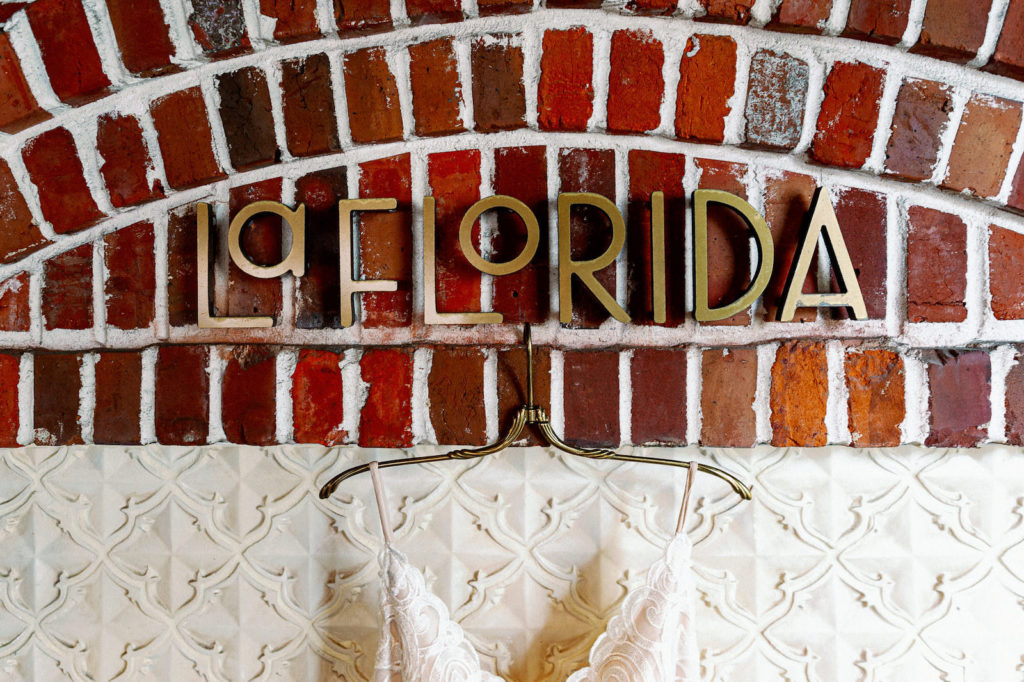 Downtown St Pete Modern Industrial Chic Wedding Venue Red Mesa Events with Red Brick Walls and La Florida Signage | Tampa Bay Wedding Photographer Dewitt for Love