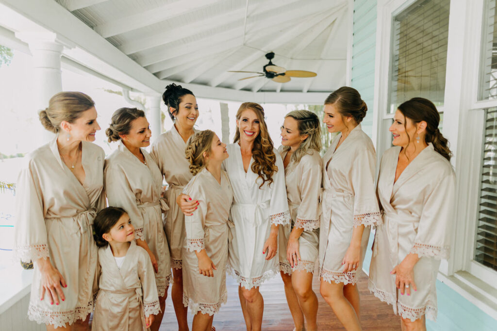 Florida Bride and Bridesmaids in Matching Tan Robes with Lace Trim | Tampa Bay Wedding Photographer Amber McWhorter Photography | Wedding Hair and Makeup Femme Akoi Beauty Studio