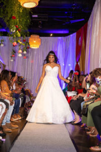 Tampa Bay Wedding Fashion Show in Ybor City, Bride Walks Down Aisle Runway in A Line Wedding Dress with Sweetheart Neckline | Designer Royal Bridal | Florida Venue 7th + Grove