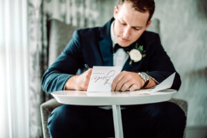 Groom Writing Vows Wedding Portrait