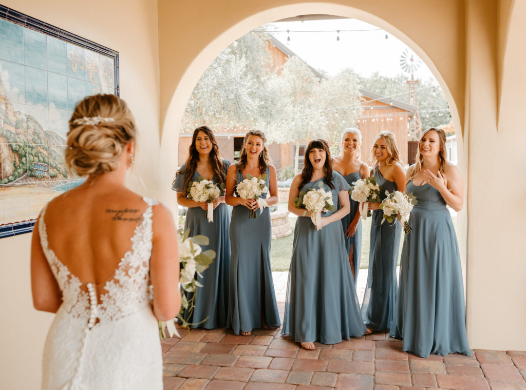 Bride First Look with Bridesmaids Portrait | Bridesmaids in Dusty Blue Long Mix and Match Bridesmaid Dresses | Dear Cleo