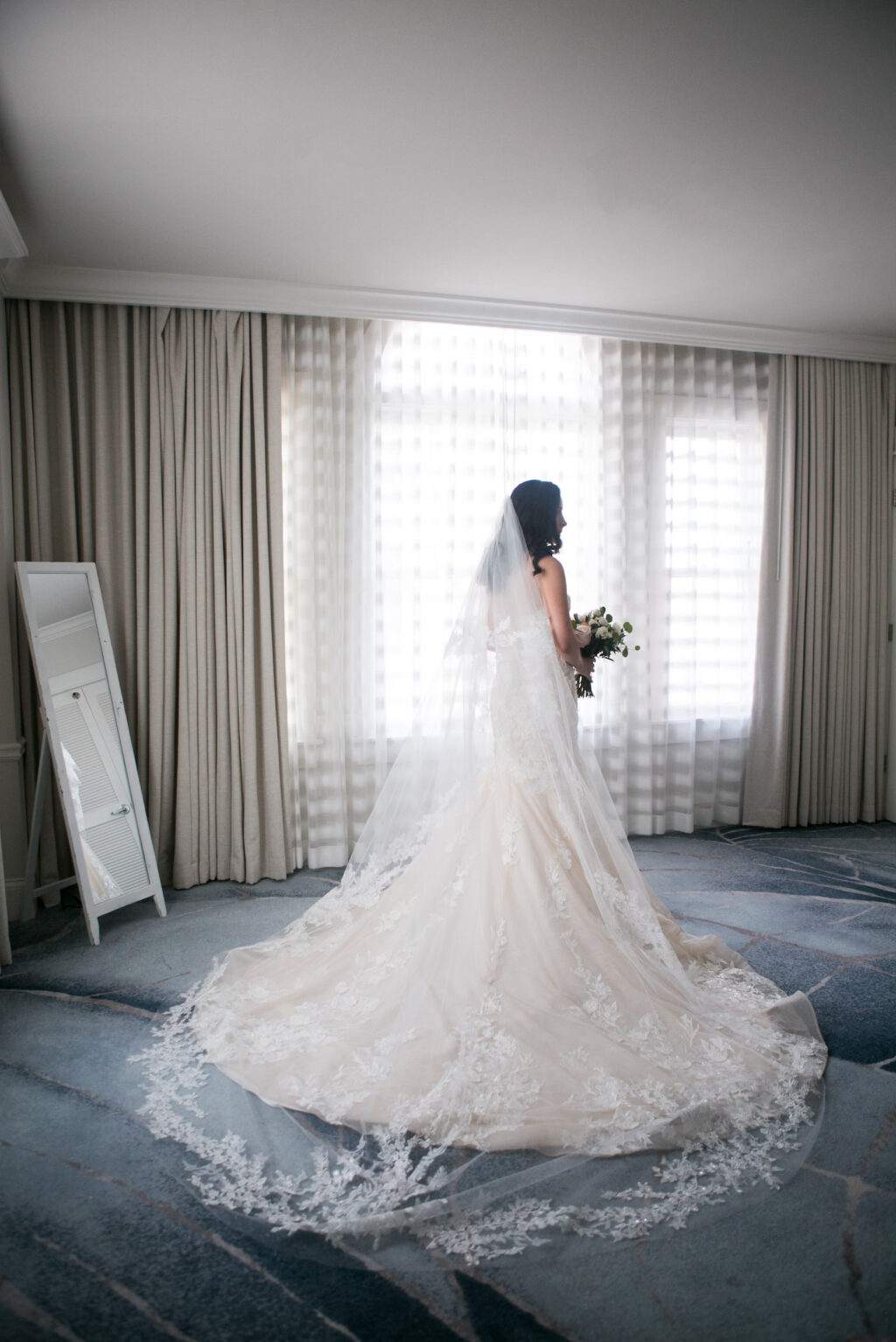 Bride in Fit and Flare Wedding Dress with Lace Detail and Long Train Veil | Winnie Couture | St. Pete Wedding Photographer Carrie Wildes Photography