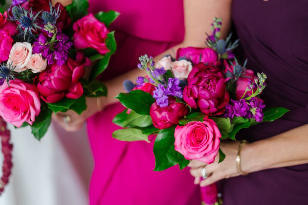 Bridesmaid Holding Jewel Toned Floral Bouquet, Fuschia Pink Roses, Purple and Greenery Floral Bouquet | Tampa Bay Wedding Florist Iza's Flowers