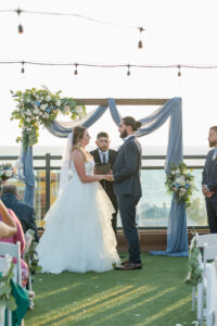 Bride and Groom Exchange Vows at St. Petersburg Rooftop Wedding | Venue Hotel Zamora