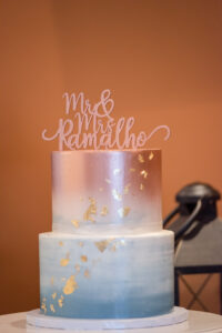 Two Tiered Dusty Blue and Rose Gold Ombre Wedding Cake with Rose Gold Cake Topper and Gold Flakes | St. Pete Cake Baker The Artistic Whisk