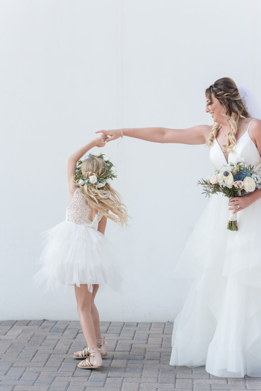 Bride in Tulle Ballgown Wedding Dress with Flower Girl in Flower Crown Portrait | Ashley Renee Bridal | Adore Bridal Hair and Makeup