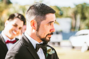 Florida groom reaction to watching bride walking down the wedding ceremony aisle | Tampa Bay wedding photographer Bonnie Newman Creative