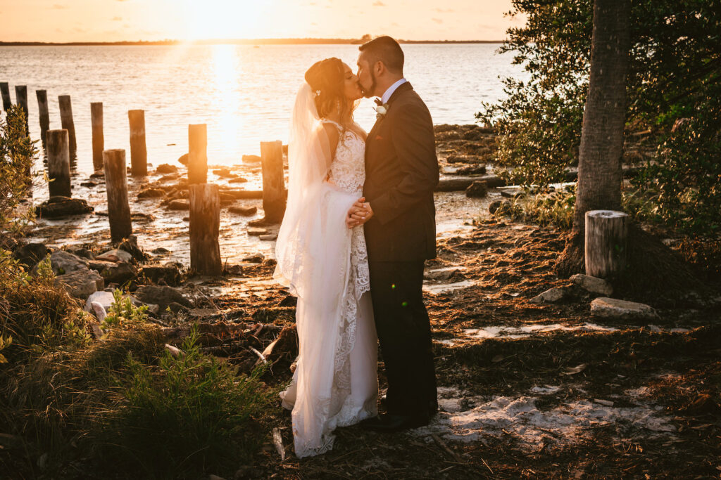Florida waterfront bride and groom sunset wedding photo | Tampa wedding photographer Bonnie Newman Creative