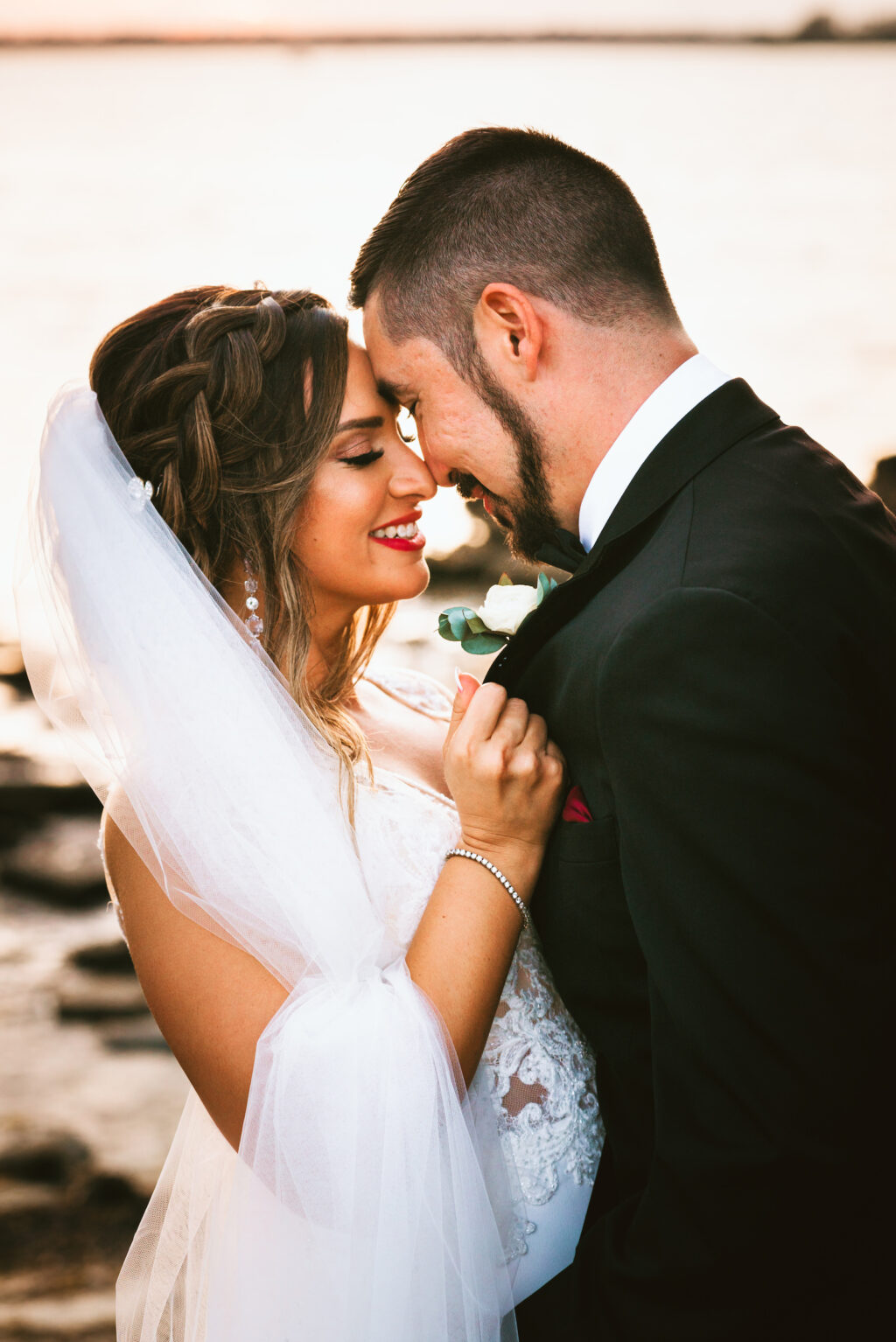 Florida bride with braided hair do, veil, red lipstick and groom wedding portrait | Tampa Bay wedding photographer Bonnie Newman Creative | Wedding hair and makeup Femme Akoi