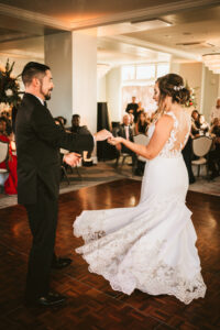 Classic bride and groom first dance in Dunedin ballroom wedding venue Fenway Hotel | Tampa Wedding photographer Bonnie Newman Creative | Wedding hair and makeup Femme Akoi