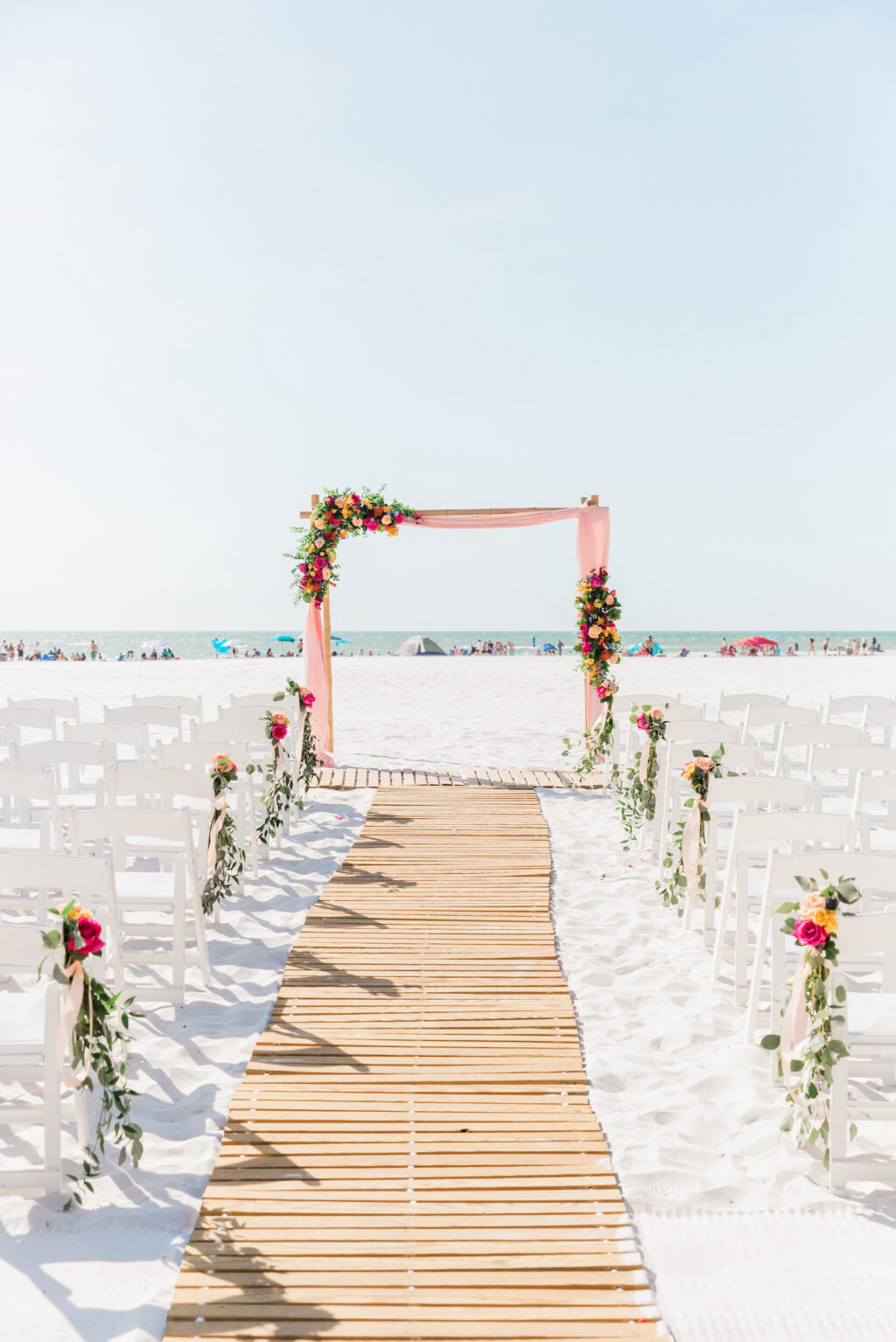 Outdoor Beachfront Wedding Ceremony with Bamboo Runner and Pink Alter Drapery | Hilton Clearwater Beach Wedding Ceremony