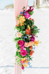 Yellow, Pink, and Orange Floral Wedding Décor Details with Greenery for Beachfront Wedding Ceremony | Hilton Clearwater Beach