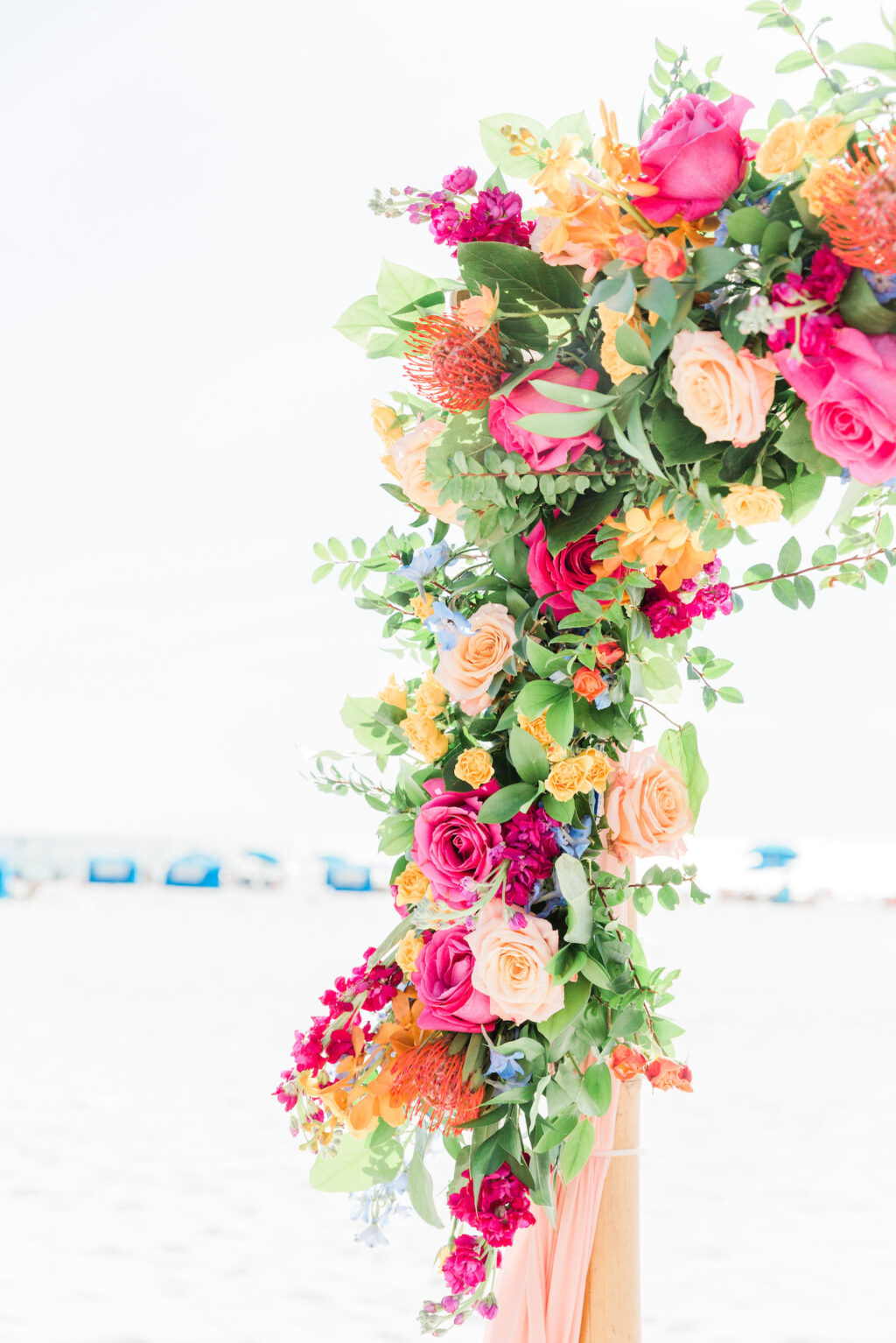 Yellow, Pink, and Orange Floral Wedding Décor Details with Greenery for Beachfront Wedding Ceremony | Hilton Clearwater Beach