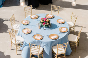 Light Blue Linen Round Reception Table with Gold Chairs and Gold Plating | Elegant Wedding Reception Table | Hilton Clearwater Beach