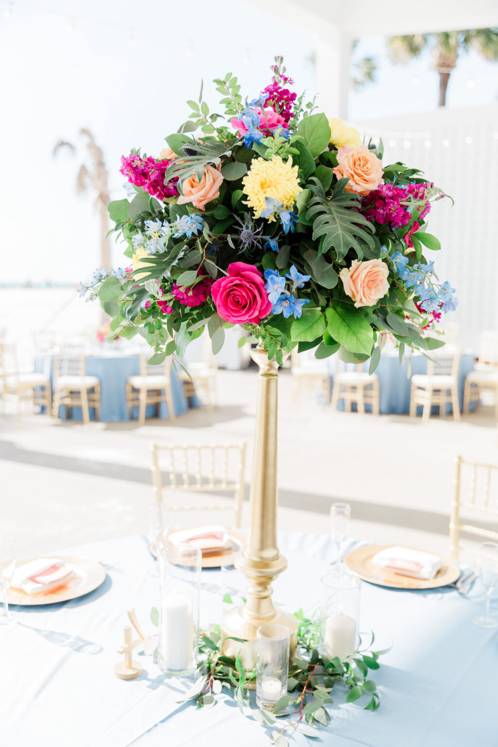 Tall Floral Centerpieces with Pink, Peach, Yellow andBaby Blue Florals and Greenery in Tall Gold Vase