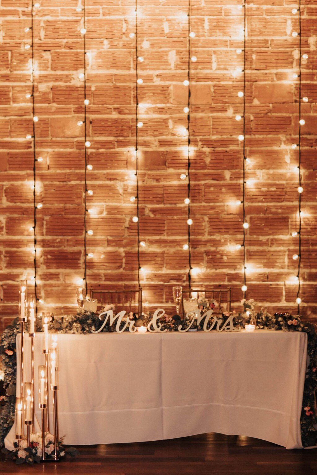 Sweetheart Table with Twinkling Light Décor in Industrial Wedding Venue | Florida Wedding Reception Nova 535