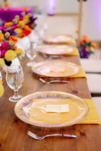 Whimsical Colorful Art Inspired Wedding Reception Decor, Gold and Clear Glass Charger, Yellow Linen Napkins | Tampa Bay Wedding Photographer Dewitt for Love | Wedding Planner Wilder Mind Events | Wedding Rentals Gabro Event Services | Wedding Linens Over the Top Rental Linens
