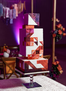 Unique Whimsical Geometric Three Tier Wedding Cake, Red, Purple, and Orange Swirled Painted Shapes | Tampa Bay Wedding Photographer Dewitt for Love | Wedding Cake The Artistic Whisk