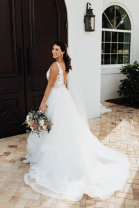 Bride in V Back Ballgown Wedding Dress | The White Magnolia, Paloma Blanca | Harborside Chapel