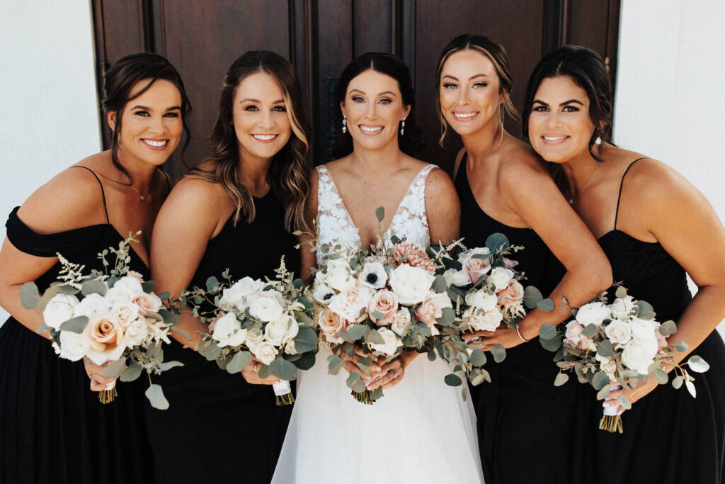 Bride with Bridesmaids in Mix and Match Black Floor Length Bridesmaid Gowns | Kleinfeld Bridal & David’s Bridal | Harborside Chapel