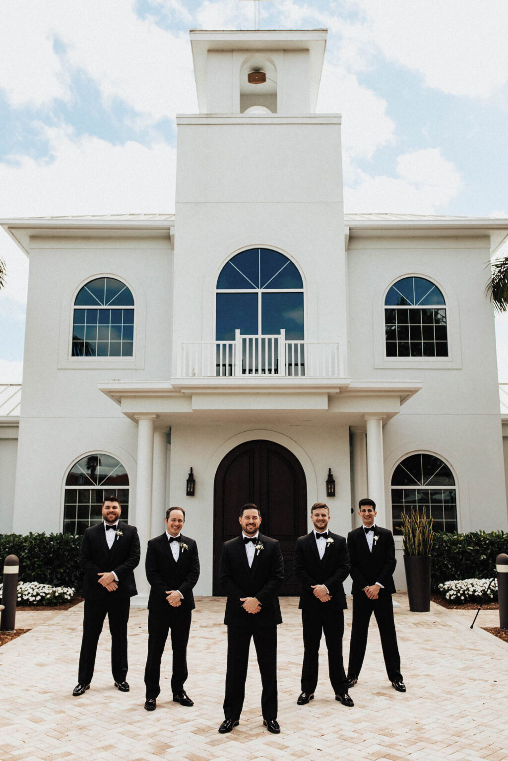 Groom and Groomsmen in Black Classic Tuxes Wedding Portrait | Florida Wedding Church Harborside Chapel