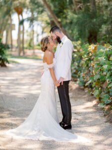 Sarasota Bride and Groom First Look, Groom in White Tuxedo Jacket, Bride Wearing Provinias Wedding Dress | Florida Wedding Venue The Resort at Longboat Key Club