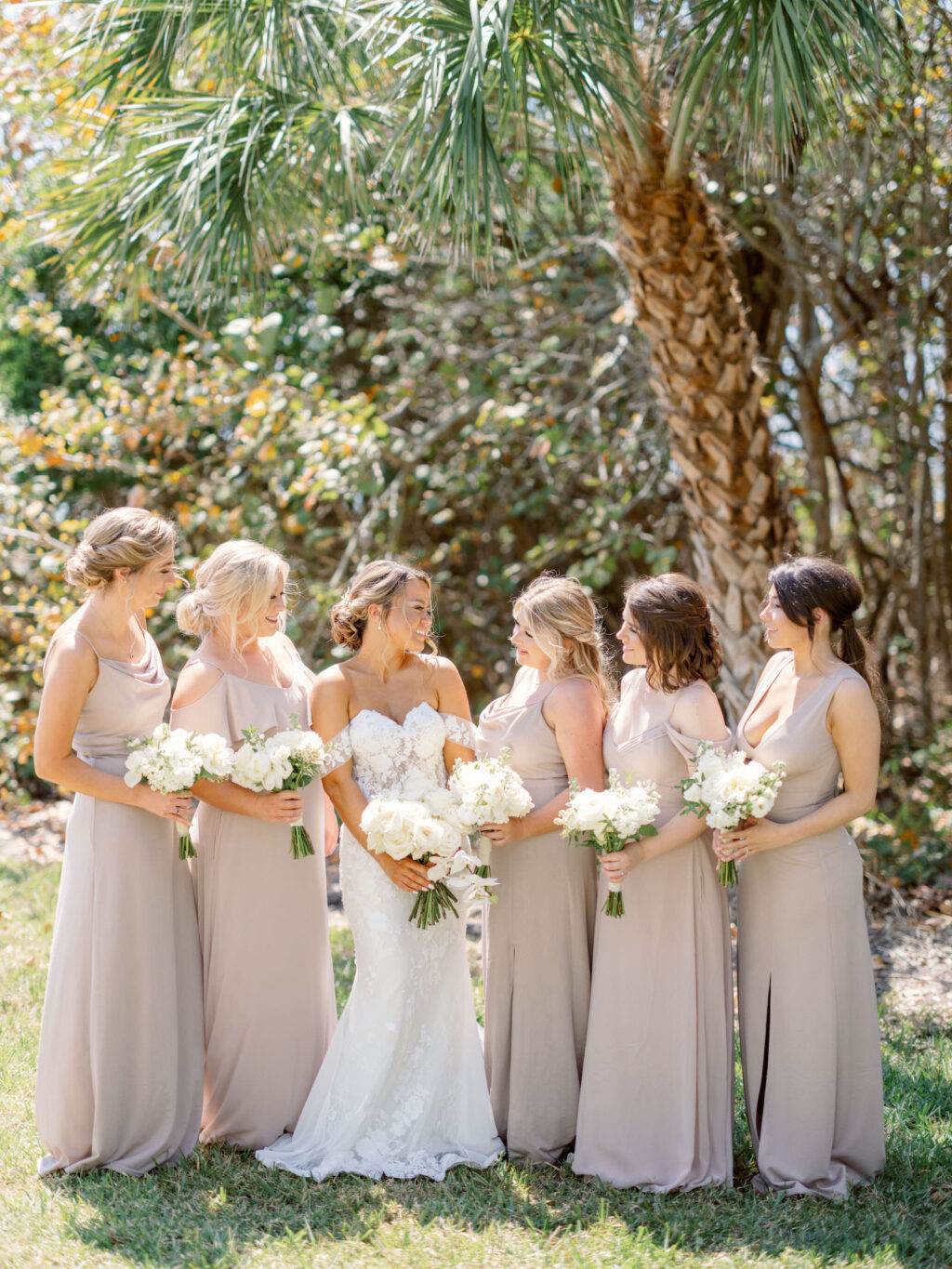 Florida Bride and Bridal Party, Wearing Beige Mismatched Long Birdy Grey Bridesmaids Dresses, Holding White Floral Bouquets, Bride Wearing Off The Should Wedding Dress