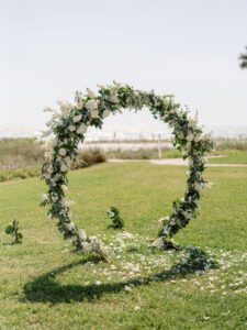 Luxurious Wedding Ceremony Arch, White and Ivory Florals with Greenery | The Resort at Longboat Key Club | South Harbourside Lawn