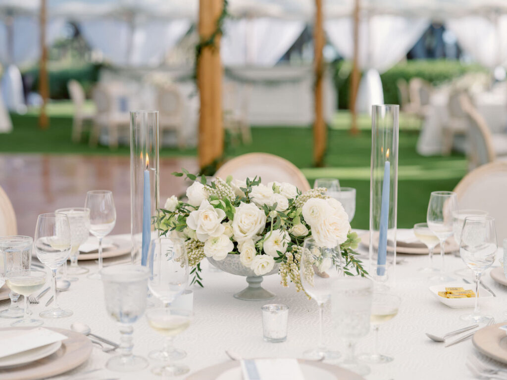 Elegant Outdoor Garden Wedding Reception Decor, Low Ivory Floral Centerpieces with White Linens on Feasting Tables with Blue Tapper Candles