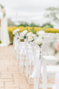Romantic Pink St. Pete Garden Wedding Ceremony Decor | White Garden Chairs with White Roses Arrangements | Tampa Bay Wedding Florist Brides N Blooms Designs