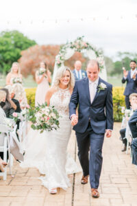 Romantic Pink St. Pete Outdoor Garden Wedding Ceremony | Bride and Groom Leaving Wedding Ceremony | Tampa Bay Wedding Florist Brides N Blooms Designs