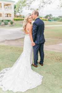 Romantic Pink Outdoor Garden St. Pete Wedding | Bride in Key Hole Open Back Lace Applique Wedding Dress Holding Hands with Groom | Wedding Venue Feather Sound Country Club