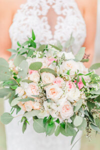 Romantic Pink Garden St. Pete Wedding | Bride Holding Blush Pink and Ivory Roses with Greenery and Eucalyptus Floral Bridal Bouquet | Tampa Bay Wedding Florist Brides N Blooms Designs