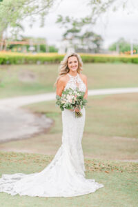 Romantic Pink St. Pete Garden Wedding | Bride Wearing Halter Lace Applique and Illusion Fitted Wedding Dress Holding Greenery and Floral Bouquet | Tampa Bay Wedding Florist Brides N Blooms Designs