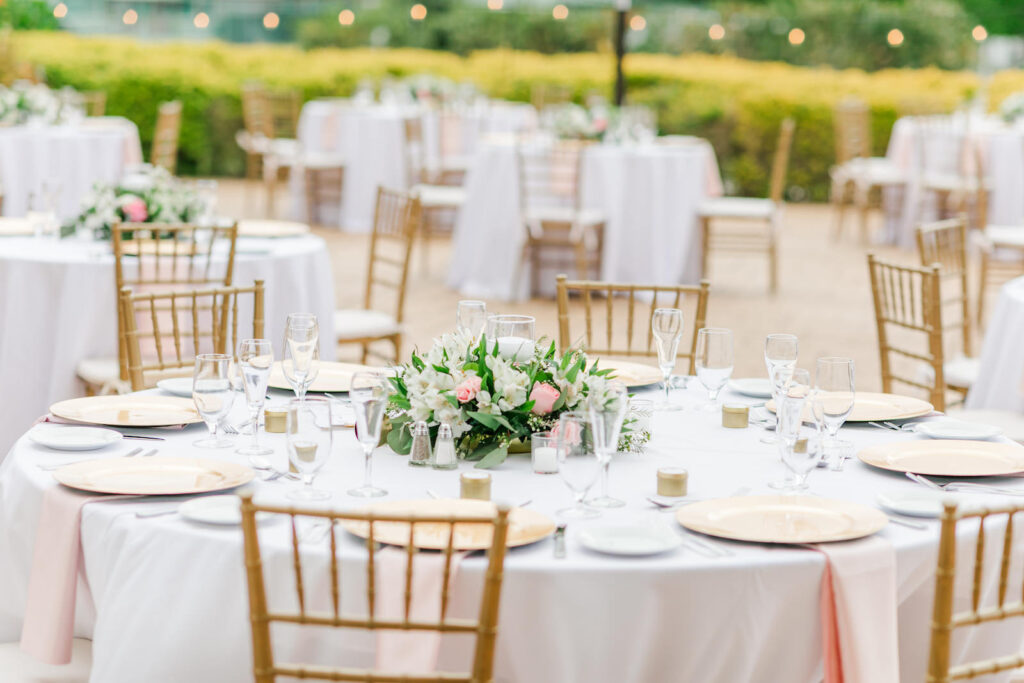 Romantic Pink Outdoor Garden St. Pete Wedding Reception | Round Tables with White Linen, Gold Chiavari Chairs, Gold Charger, Low Greenery and White and Pink Floral Centerpiece | Tampa Bay Wedding Florist Brides N Blooms Designs